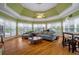 Open living room with hardwood floors, crown molding, and abundant natural light at 625 W Lake Dr, Oxford, GA 30054