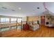 Comfortable living room with a high ceiling, hardwood floors, and view to the floor below at 625 W Lake Dr, Oxford, GA 30054
