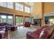 Bright living room with fireplace, water views and comfortable seating at 625 W Lake Dr, Oxford, GA 30054