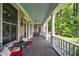 Spacious porch with comfortable seating arrangements, perfect for entertaining and relaxation at 625 W Lake Dr, Oxford, GA 30054