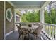 Charming porch with outdoor seating, ideal for enjoying the scenery and fresh air at 625 W Lake Dr, Oxford, GA 30054