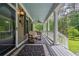 Inviting porch with a cozy bench and elegant columns, creating a welcoming outdoor space at 625 W Lake Dr, Oxford, GA 30054