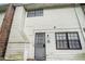Back of property with siding and black trimmed windows and door at 6354 Shannon Pkwy # 30C, Union City, GA 30291