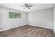 Relaxing bedroom featuring hardwood flooring and natural light from a window at 6354 Shannon Pkwy # 30C, Union City, GA 30291