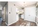 Bright dining area with a modern chandelier and a view into the updated kitchen at 6354 Shannon Pkwy # 30C, Union City, GA 30291