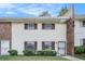 Charming two-story townhome features a brick accent and updated windows with dark shutters at 6354 Shannon Pkwy # 30C, Union City, GA 30291