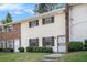 Attractive townhouse with a brick chimney, a tidy lawn and updated windows with dark shutters at 6354 Shannon Pkwy # 30C, Union City, GA 30291
