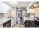 Updated kitchen with white cabinets, granite countertops, and new stainless steel appliances at 6354 Shannon Pkwy # 30C, Union City, GA 30291