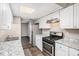 Updated kitchen with white cabinets, granite countertops, and new stainless steel appliances at 6354 Shannon Pkwy # 30C, Union City, GA 30291
