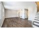 Spacious living room with new floors and paint, leading to the staircase and other rooms at 6354 Shannon Pkwy # 30C, Union City, GA 30291