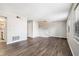 Well-lit living area featuring modern floors and neutral walls, leading to the staircase and kitchen at 6354 Shannon Pkwy # 30C, Union City, GA 30291