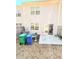 A compact backyard with concrete patio, fenced perimeter and access via sliding glass doors at 6408 Kennonbriar Ct, Lithonia, GA 30058