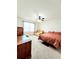 Bedroom with desk and sofa seating area, ceiling fan, and natural light at 6408 Kennonbriar Ct, Lithonia, GA 30058