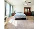 Bright bedroom with plush carpet, ceiling fan and minimalist decor that creates a calming atmosphere at 6408 Kennonbriar Ct, Lithonia, GA 30058