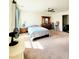 Spacious bedroom featuring carpeted floor, ceiling fan and natural light at 6408 Kennonbriar Ct, Lithonia, GA 30058