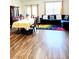 Open dining room showcasing wood floors and comfortable seating at 6408 Kennonbriar Ct, Lithonia, GA 30058