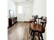 Inviting foyer showcasing wood-look flooring and a decorative bookshelf at 6408 Kennonbriar Ct, Lithonia, GA 30058