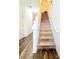 Hallway featuring a carpeted staircase leading to the upper level at 6408 Kennonbriar Ct, Lithonia, GA 30058