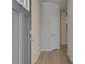 Inviting entryway featuring wood-look floors, neutral walls, and a gray front door at 8210 Tiger Way, Riverdale, GA 30296