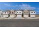Beautiful new townhomes featuring brick and siding, individual garages and neutral color palettes at 8210 Tiger Way, Riverdale, GA 30296