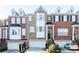 Beautiful townhome with a brick facade, bay windows, and attached garages for convenient parking at 1292 Creekside Se Ter, Smyrna, GA 30082