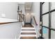 Welcoming foyer with hardwood floors, gray walls, staircase, and elegant trim detailing at 1292 Creekside Se Ter, Smyrna, GA 30082