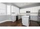 Stylish kitchen with white and gray cabinets, stainless steel appliances, and a center island at 1292 Creekside Se Ter, Smyrna, GA 30082