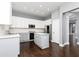 Bright kitchen features white and gray cabinets, stainless steel appliances, and island with seating at 1292 Creekside Se Ter, Smyrna, GA 30082