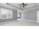 Large main bedroom with neutral tones and many windows at 1292 Creekside Se Ter, Smyrna, GA 30082