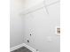 Unfinished utility closet with access to plumbing and wiring, as well as shelving at 1292 Creekside Se Ter, Smyrna, GA 30082