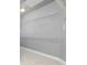 Walk-in closet equipped with shelves for ample storage space in this home at 1292 Creekside Se Ter, Smyrna, GA 30082