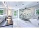 Beautiful bathroom features marble walls, a large glass shower, and a modern soaking tub at 2110 Fairway Ne Cir, Brookhaven, GA 30319