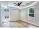 Bedroom featuring wood floors, recessed lighting and multiple windows offering lots of natural light at 2110 Fairway Ne Cir, Brookhaven, GA 30319