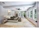Bright bedroom with hardwood floors, large windows, and a serene view at 2110 Fairway Ne Cir, Brookhaven, GA 30319