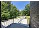 View from the front door to the driveway and lush greenery, showcasing the property's setting at 2110 Fairway Ne Cir, Brookhaven, GA 30319