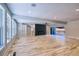 Bright and open living room with hardwood floors, a modern fireplace, and access to an outdoor area at 2110 Fairway Ne Cir, Brookhaven, GA 30319