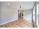 An empty living room with hardwood floors and modern lighting at 2110 Fairway Ne Cir, Brookhaven, GA 30319