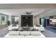 Stylish living room featuring modern furniture, a sleek fireplace, and sliding doors to outdoor deck at 2110 Fairway Ne Cir, Brookhaven, GA 30319
