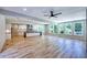 Expansive living room with hardwood floors, modern ceiling fan, and lots of windows for natural light at 2110 Fairway Ne Cir, Brookhaven, GA 30319