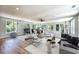 Bright living room with a ceiling fan and large windows offering natural light at 2110 Fairway Ne Cir, Brookhaven, GA 30319