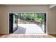 Indoor view of home's patio, with folding doors that open to the outdoor wooden deck at 2110 Fairway Ne Cir, Brookhaven, GA 30319