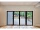 Indoor view of home's patio, with folding doors that open to the outdoor wooden deck at 2110 Fairway Ne Cir, Brookhaven, GA 30319