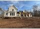 Charming two-story modern farmhouse featuring white siding and a lovely stone retaining wall at 2226 Upper Burris Rd, Canton, GA 30114