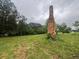 Cleared homesite featuring a historic stone chimney at 2226 Upper Burris Rd, Canton, GA 30114