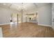 Bright living room with hardwood floors, coffered ceilings, and open floor plan to kitchen and dining at 2226 Upper Burris Rd, Canton, GA 30114
