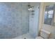 Shower boasting modern tile work, a glass partition and a rain shower head at 3263 Long Iron Pl, Lawrenceville, GA 30044