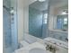 Bathroom featuring a tiled shower, glass door, and a marble vanity at 3263 Long Iron Pl, Lawrenceville, GA 30044