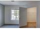 Bedroom with carpet, a window for natural light, and walk in closet at 3263 Long Iron Pl, Lawrenceville, GA 30044