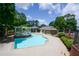 Community pool with a pergola, lounge chairs, and well-kept landscaping at 3263 Long Iron Pl, Lawrenceville, GA 30044