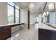 Bathroom featuring double vanities, hexagon tile flooring, chandelier and natural light at 3376 Peachtree Ne Rd # 35A, Atlanta, GA 30326